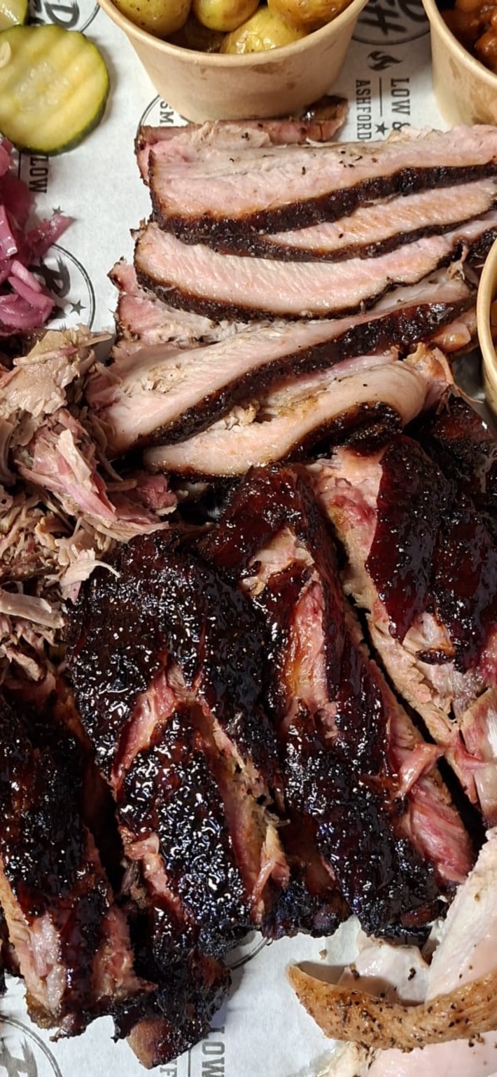 Smoked beef ribs on a metal barbecue tray