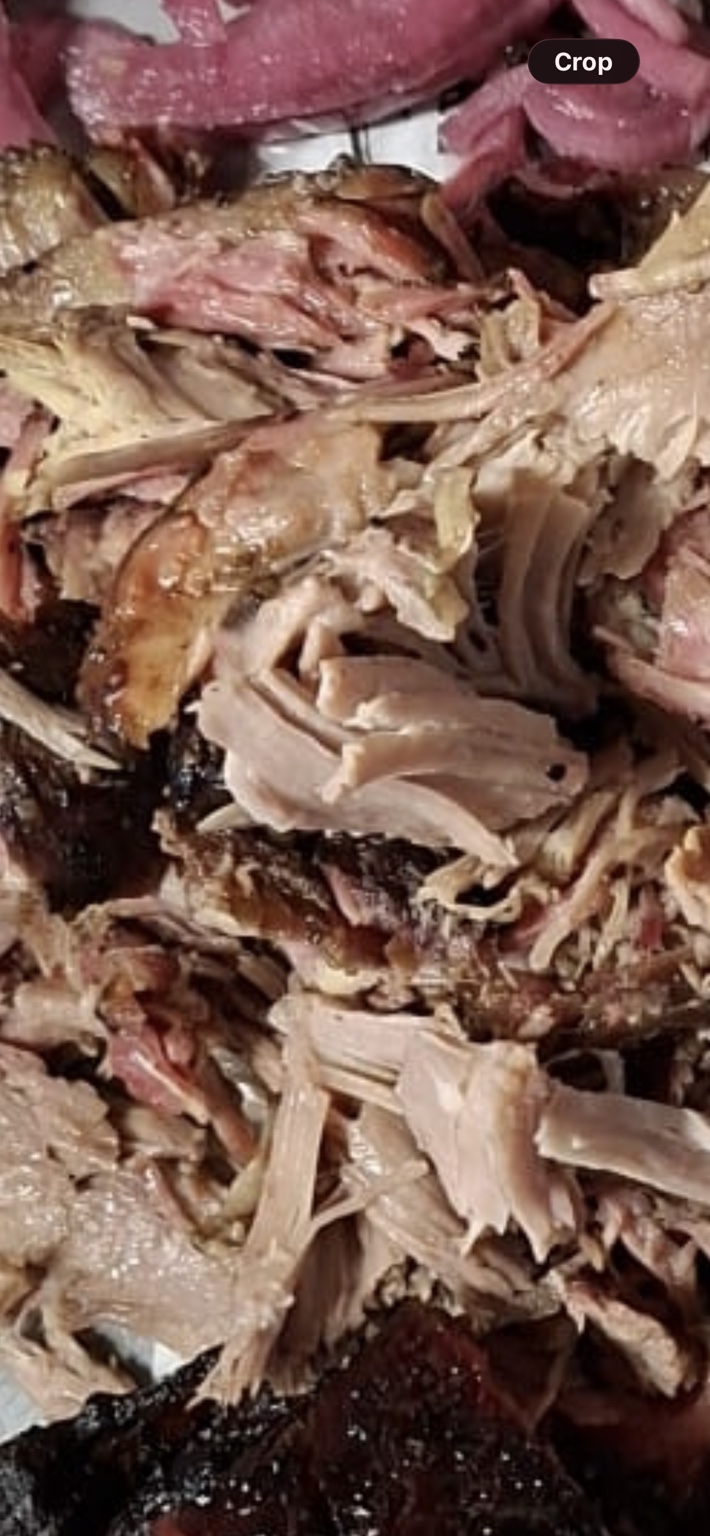Our slow-smoked pulled pork with dark bark and tender strands